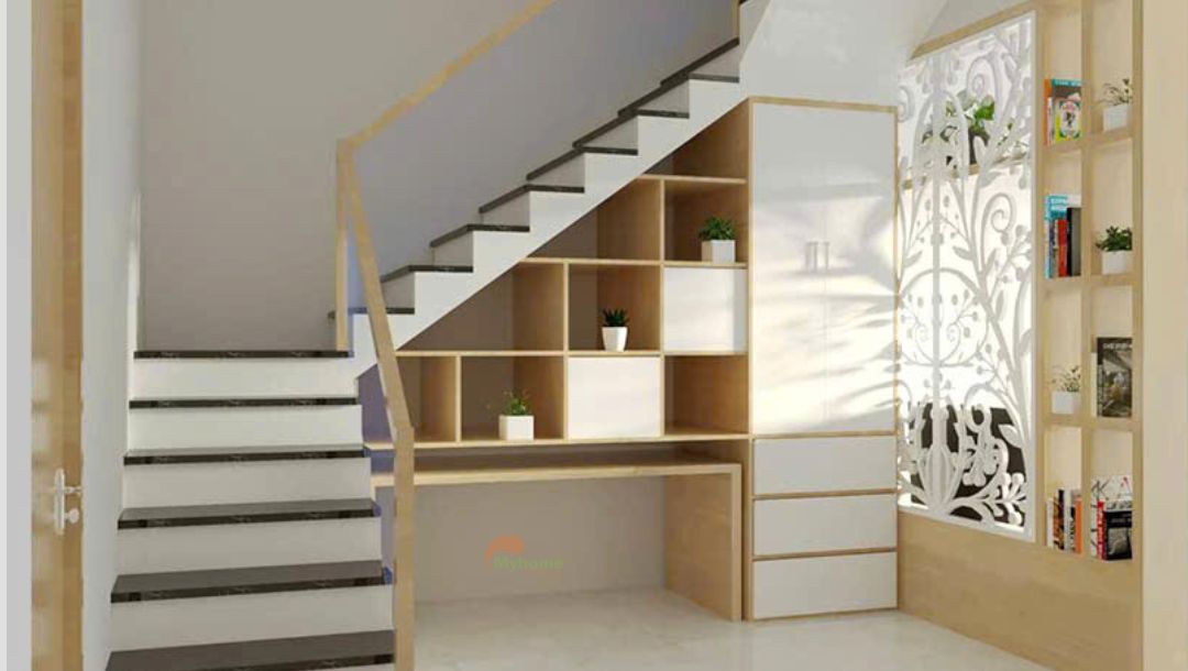 Tủ gầm cầu thang biến thành không gian riêng tư với bàn học và giá sách chill chill