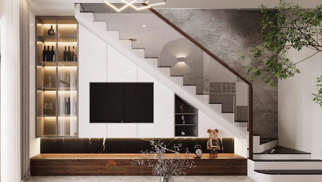 Kệ tivi được thiết kế cách điệu dưới cầu thang. Vị trí hạn chế nhưng không làm mờ nhạt đi sự hiện đại của nó