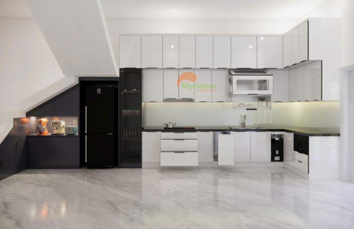 Hệ tủ dưới chia ngăn kéo lớn, ray giảm chấn êm ái, giúp sắp xếp xoong nồi và vật dụng bếp gọn gàng.